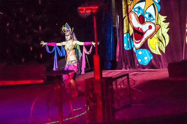 Tamer in the circus and his charming Assistant in attraction "The Tale Of The East" — Stock Photo, Image