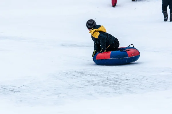 Baby winter sledding on the Ural River, — Stock Photo, Image