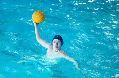The boys play in water polo. clipart