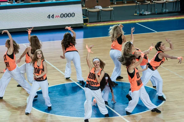 Girls cheerleading appear on basketball parquet