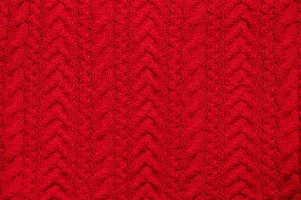 Красный вязаный текстурированный свитер фон с узором. Шаблон обоев. Складной свитер или шарф — стоковое фото