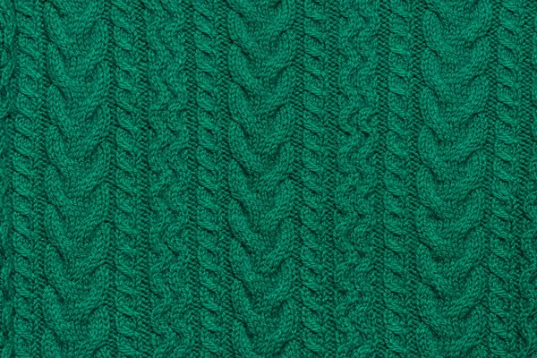 Close Up Of Green Handmade Knitwear with Ornaments, Braids and Arcanes. Обложка вязания или шаблон обоев — стоковое фото