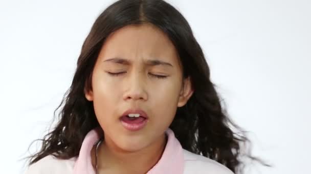 Closeup shot of a cute little girl singing on white background — Stock video