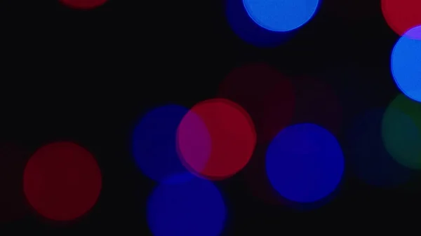 Red and blue shimmering shining lights Deep bokeh abstract backdrop in blurring
