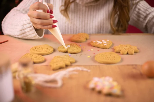 Closeup making handmade cookies edible decoration for xmas tree, baking