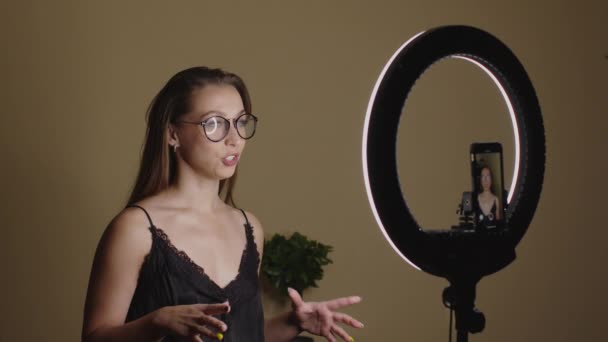 Young woman female blogger streaming from studio, recording online podcast — Stock Video