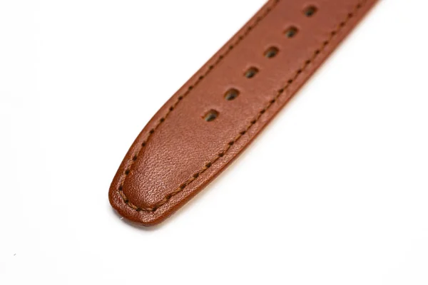 Buckle holes on brown leather belt or wrist strap of swiss made watch — Stock Photo, Image