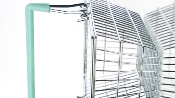 Vertical video Empty metal shopping basket with handles rotating on isolated white background — Stock Video
