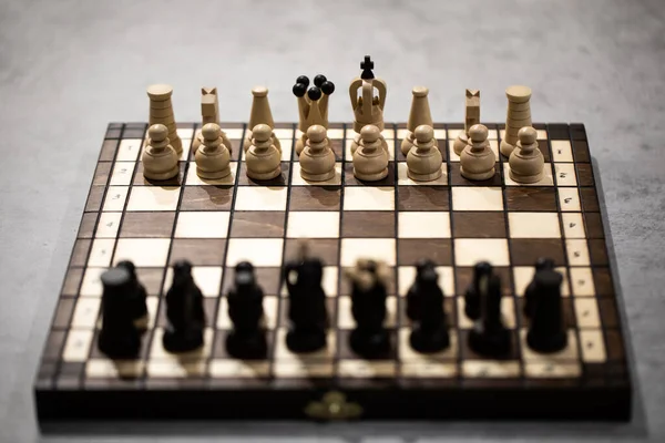 Chess pieces on board in incorrect initial position. king is not in his cell — Stock Photo, Image