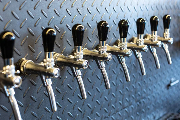 Pilsen, Czech Republic, 1.09.2019 - lots of taps to dispense beer in pub — Stock Photo, Image