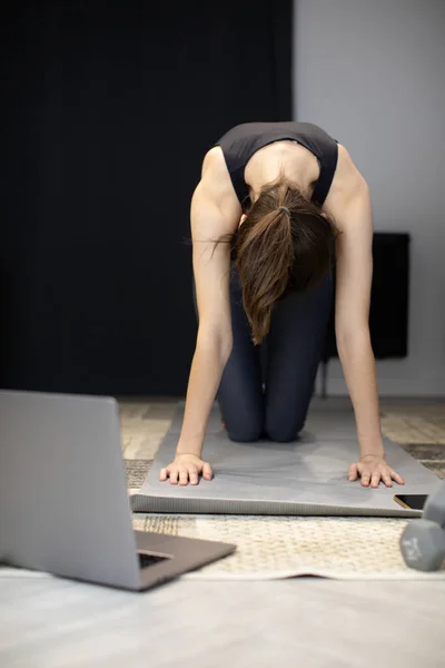 Yogi girl working out Table pose on hands and knees at beginners yoga courses