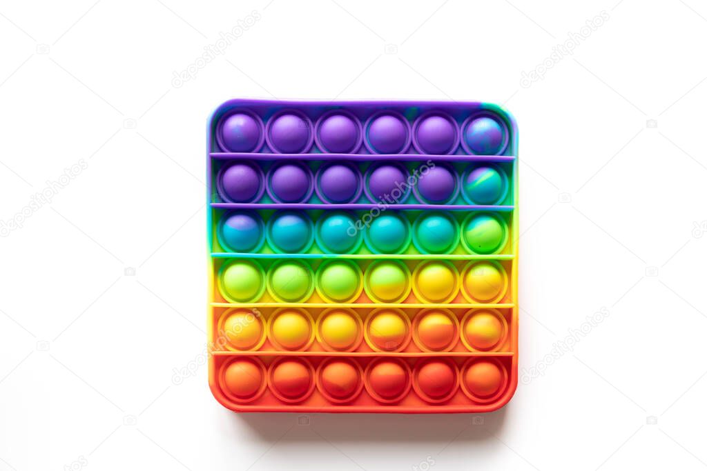 Pop It anti-stress Fidget toy, colorful rainbow game isolated white background