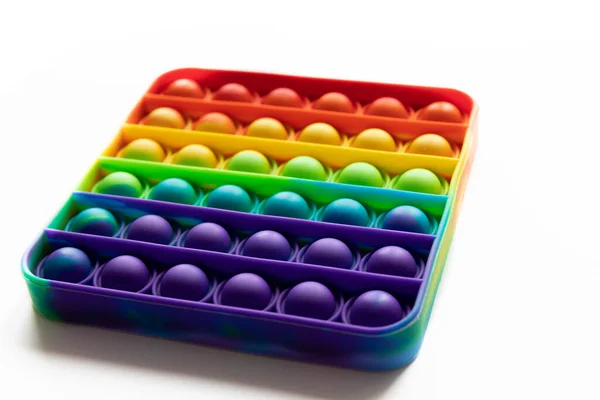 Pop It anty-stres Fidget zabawki, kolorowe tęczy gry izolowane białe tło — Zdjęcie stockowe