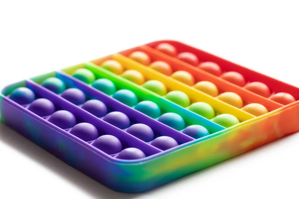Pop It juguete Fidget anti-estrés, colorido juego de arco iris aislado fondo blanco — Foto de Stock
