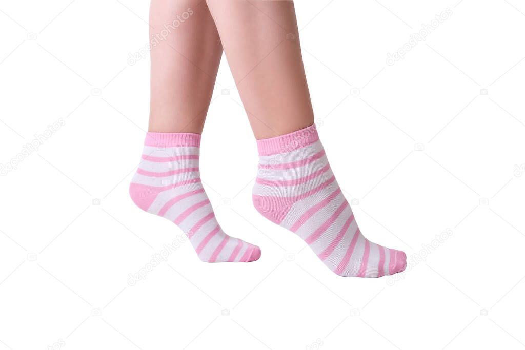 Woman female legs wearing pink and white striped plain cotton socks of classic style with elastic band isolated on white.