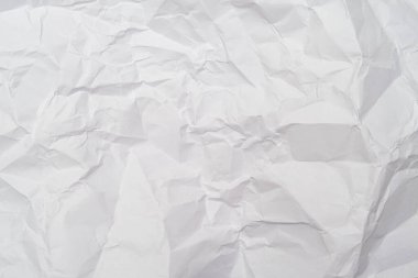 Kırışıklık, tasarım ve web için zemin oluşturan beyaz buruşuk kağıtlardan oluşan bir zemin