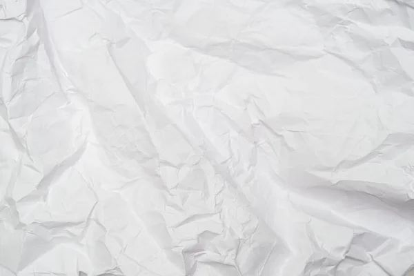 Un fond de feuille de papier froissé blanc avec des rides, toile de fond pour le design et la toile — Photo