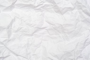 Kırışıklık, tasarım ve web için zemin oluşturan beyaz buruşuk kağıtlardan oluşan bir zemin