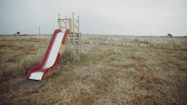 Empty Children Slide Field Abandoned City Desolate Playground Deserted Place — Stock Video