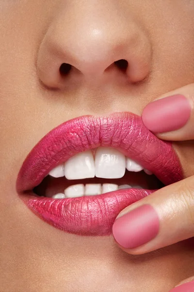 Lips with pink lipstick and fingers in photo — Stock Photo, Image