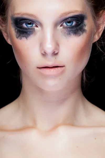 Gorgeous woman with black crying make up