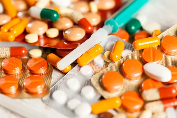 Bunch of colorful pills with blurred background — Stock Photo, Image