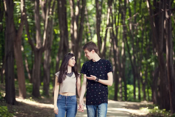 Couple walking and smiling each other — Stock Photo, Image