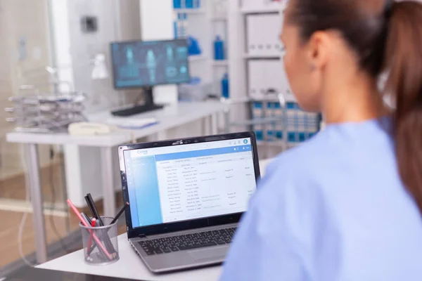 Medical nurse checking patient documentation