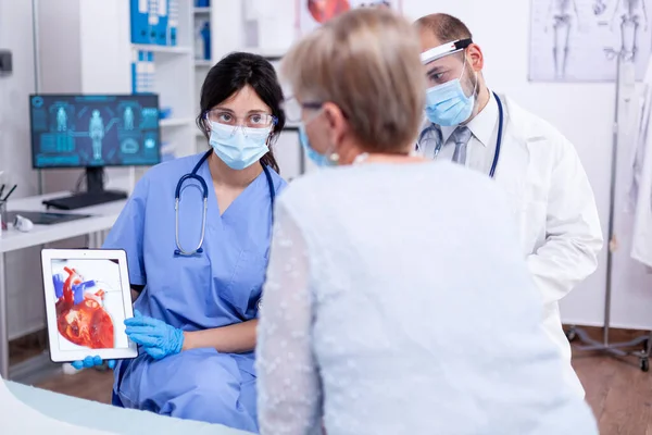 Senior woman suffering of arrhytmias — Stock Photo, Image