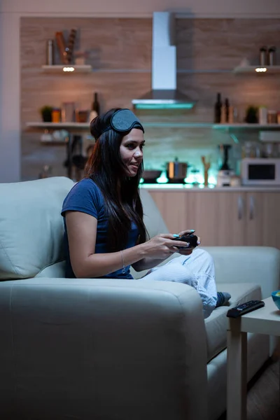 Woman playing video games on console