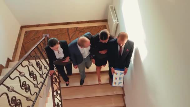 Top view of business colleagues climbing up together on stairs — Stock Video