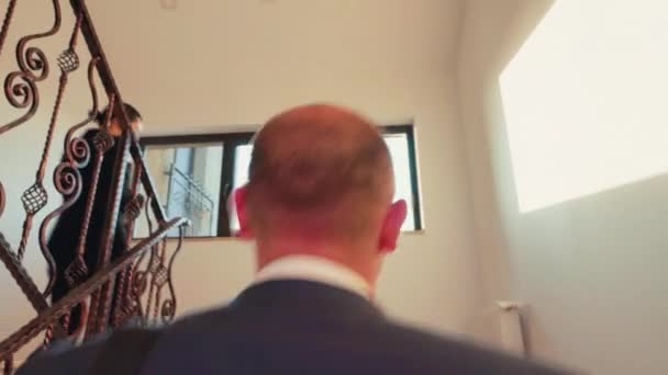 Back view of tired businessman arriving on business office — Stock Video