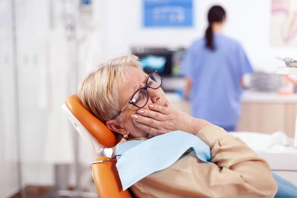 Elderly patient waiting diagnostic from dentist doctor