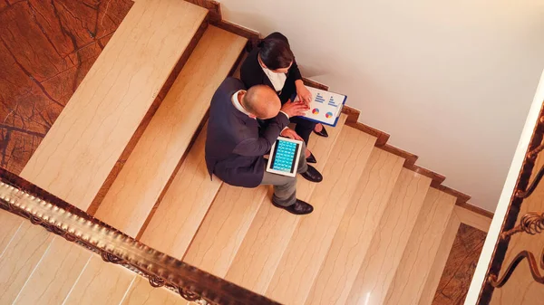 Top view of business people working on deadline project