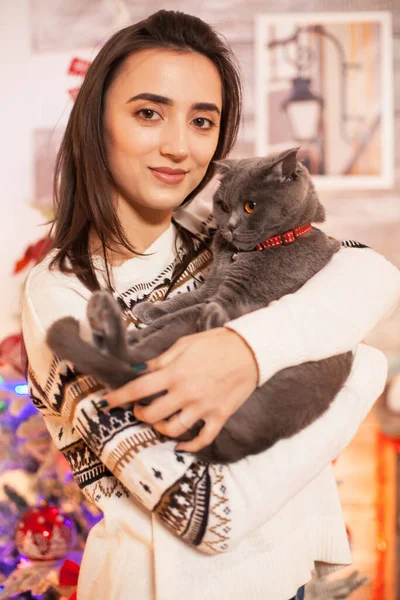 Portrait of happy girl holding her cat — Stock Photo, Image