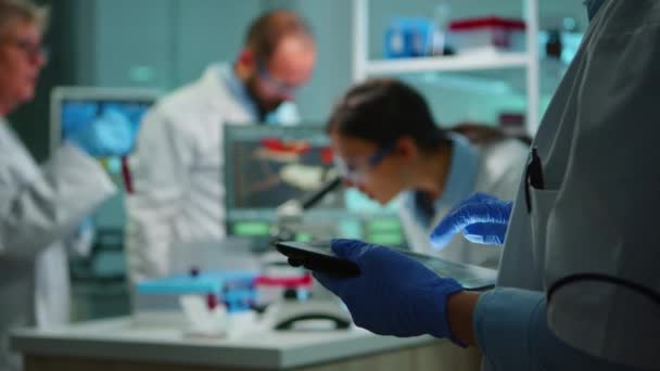 Close up of chemist nurse using tablet — Stock video