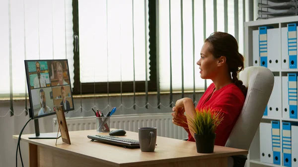Freelancer having video call in office — Stock Photo, Image