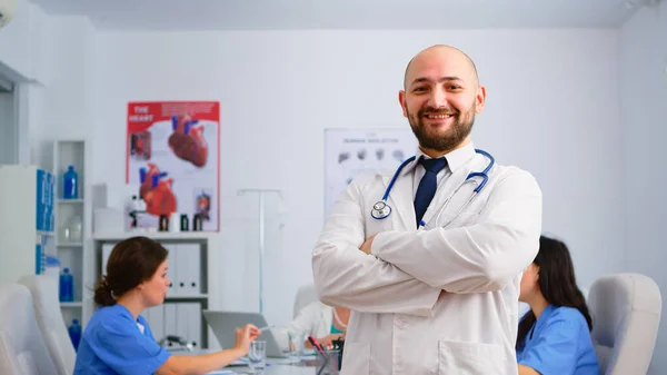 Portrait of young man doctor smiling at camera — Stock Photo, Image