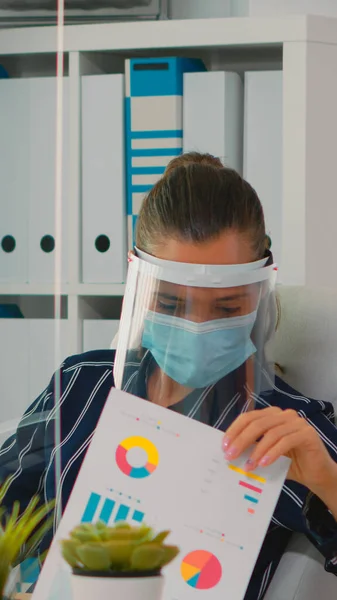 Businesswoman wearing face protection on new normal workplace
