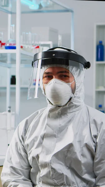 Portret van vermoeide chemicus arts in coverall — Stockfoto
