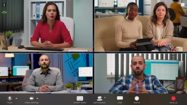 Mitarbeiter spricht per Videotelefon mit verschiedenen Kollegen — Stockvideo
