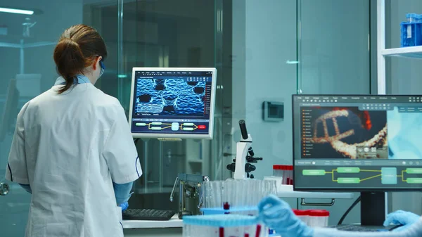 Scientist nurse typing medical reports on computer