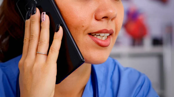 Healthcare physician consulting remote patients using phone