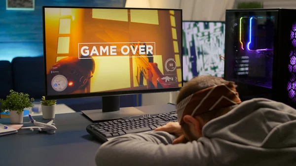 Digital gamer keeping his head on the office