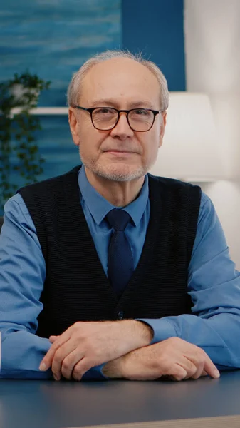 Portrait of senior man chatting and listening remote teamwork