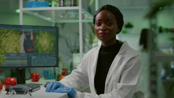 Closeup of african biologist woman looking into camera — Stock Video