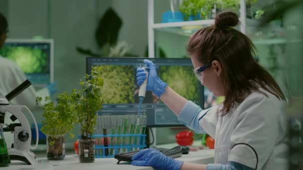 Biologist scientist putting solution liquid in test tube — Stock Video