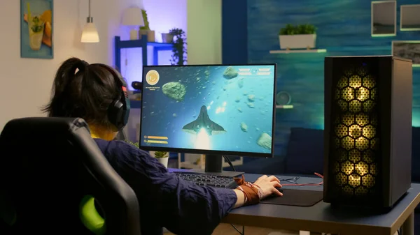 Back shot of focused cyber player wearing headset — Stock Photo, Image