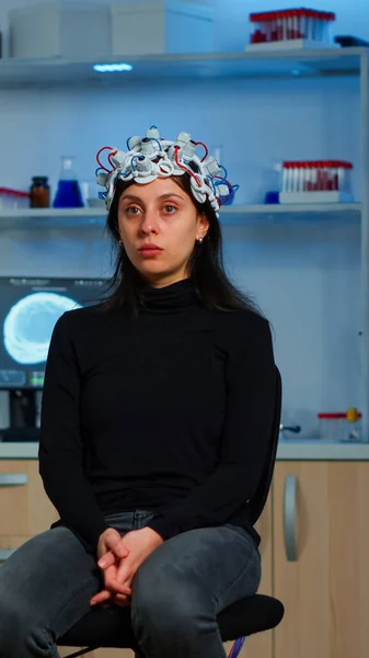 Researcher and patient with eeg headset looking at virtual display — Stock Photo, Image