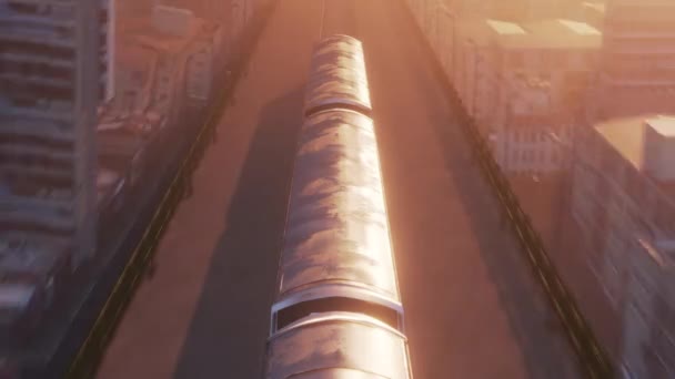 Aerial view of train in warm sunset light passing through city — Stock Video